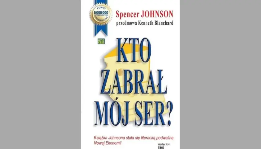 Okładka książki "Kto zabrał mój ser?" Spencera Johnsona. Wielki kawałek sera z napisem "KTO ZABRAŁ MÓJ SER?".